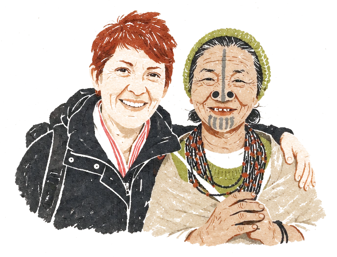 Illustration of a smiling traveler arm in arm with an elderly Apatani woman with a face tattoo and nose plugs