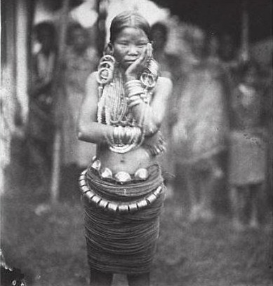 An Abor (Adi) girl in brass ornaments