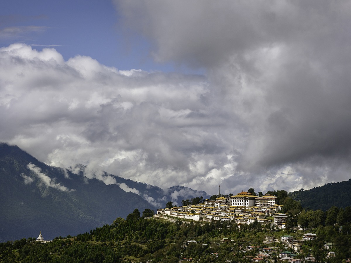 Tawang monastery spread along its ridge under heavy cloud