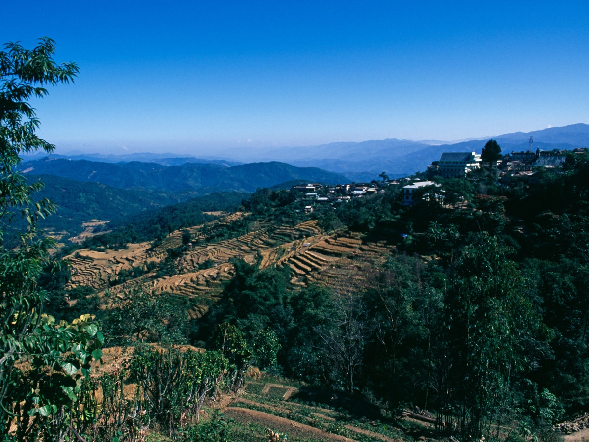 A hilltop village above terraced fields in the Naga Hills