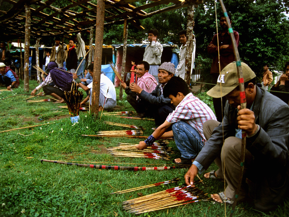 Khasi archers sorting arrows before a game of Siat Khnam