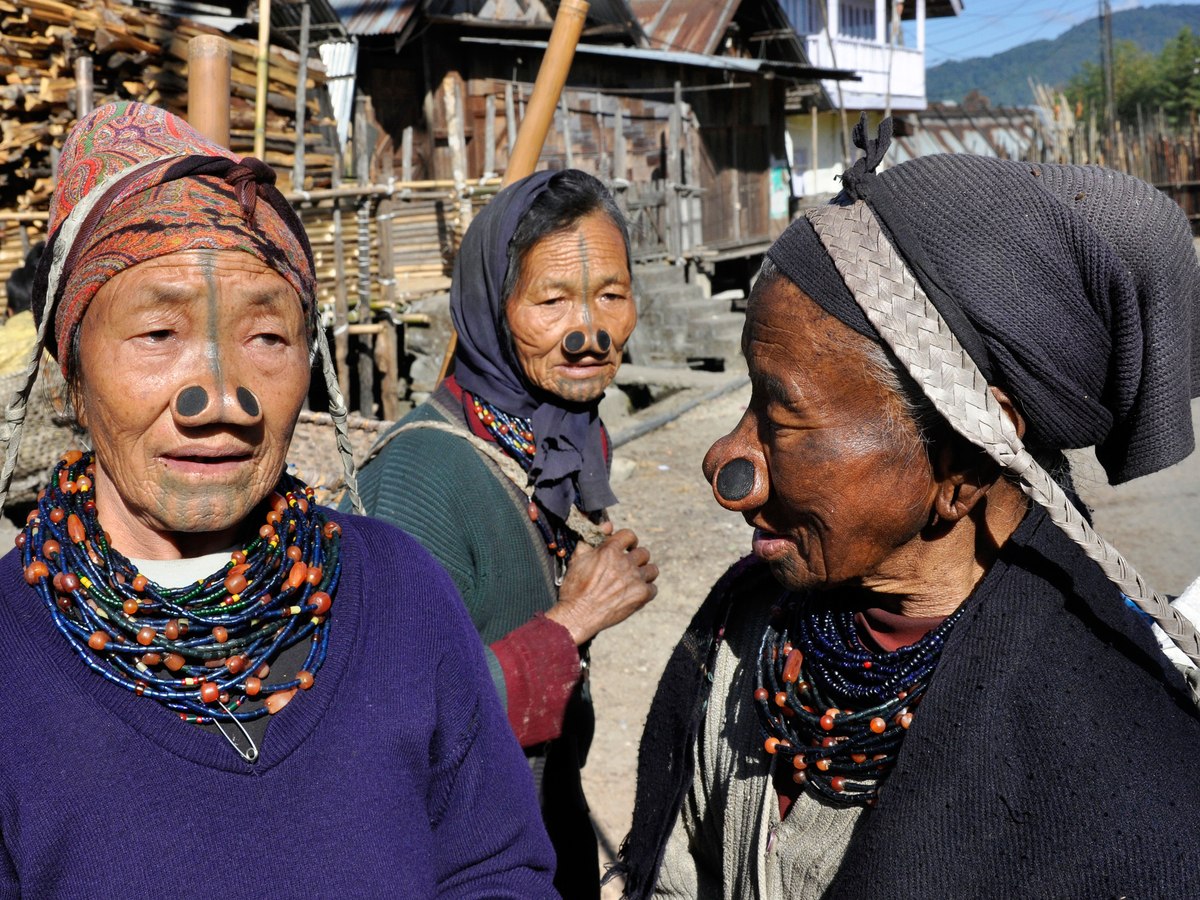Apatani women with traditional facial tattoos in Ziro Valley