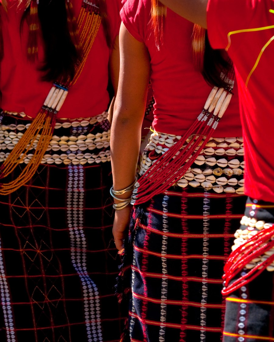 Detail of traditional tribal dress and jewelry